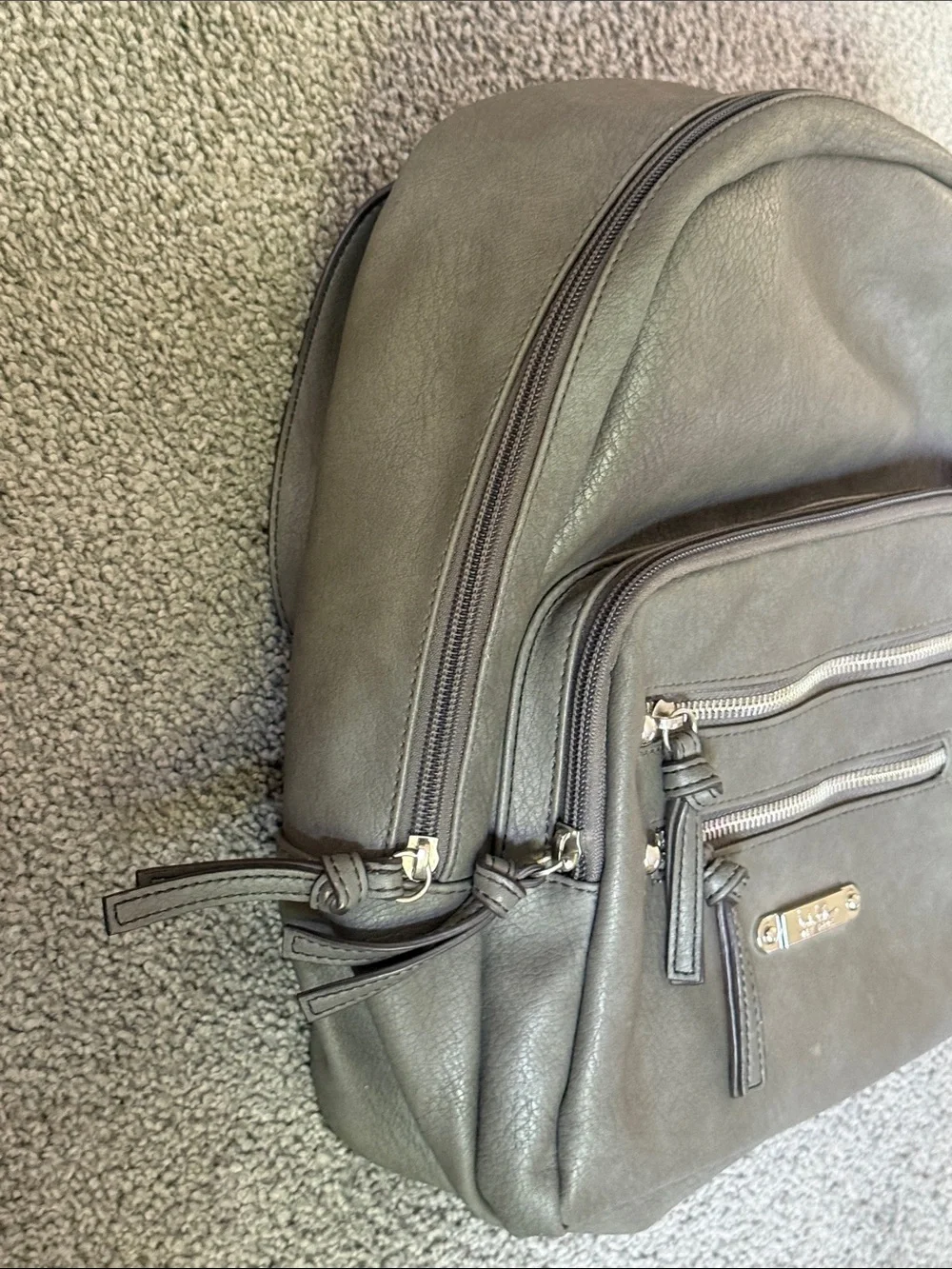 Nicole Miller Gray Faux Leather Backpack Bag. Adjustable Straps. 12”x12”x4”.